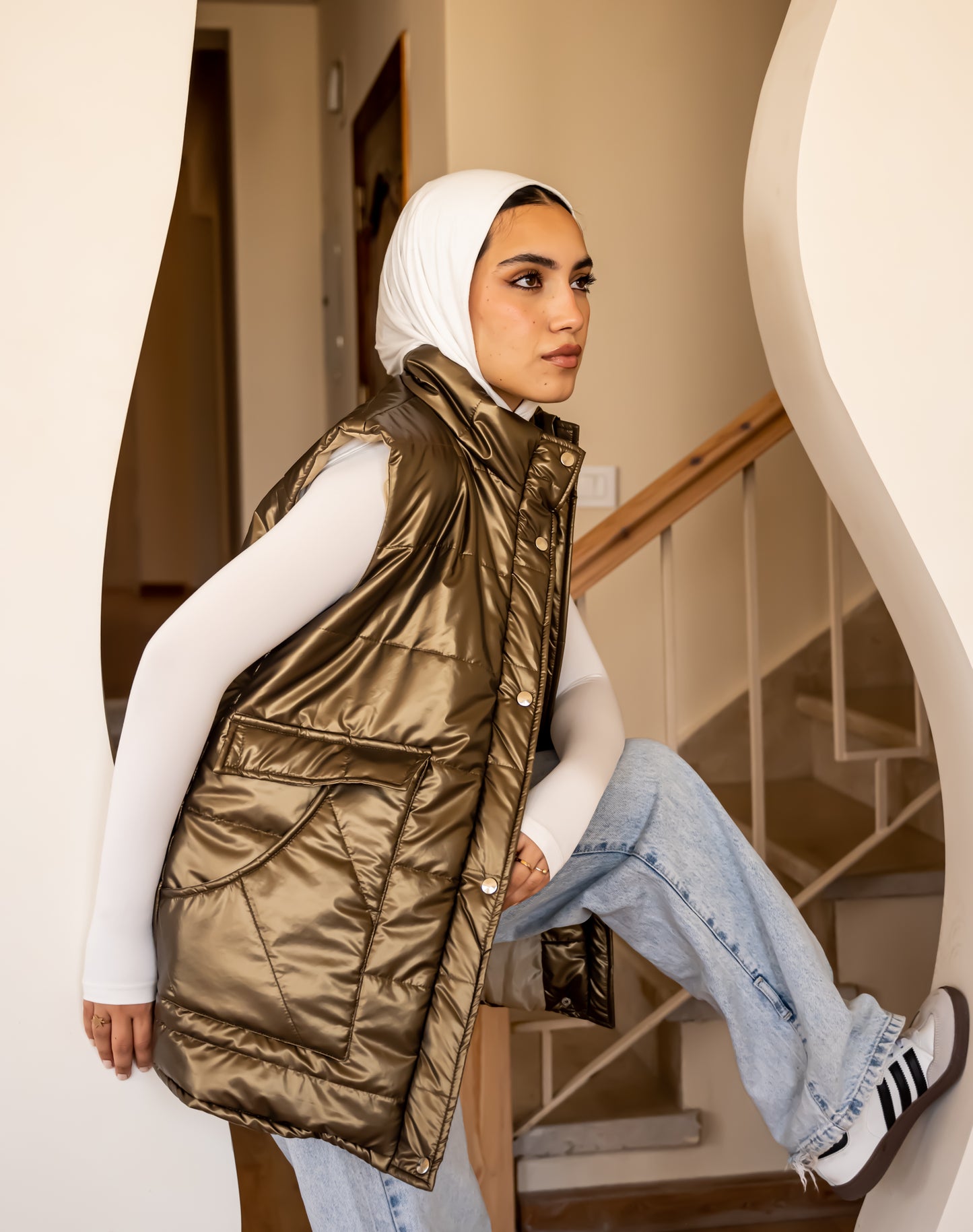 Metallic puffer vest in gold